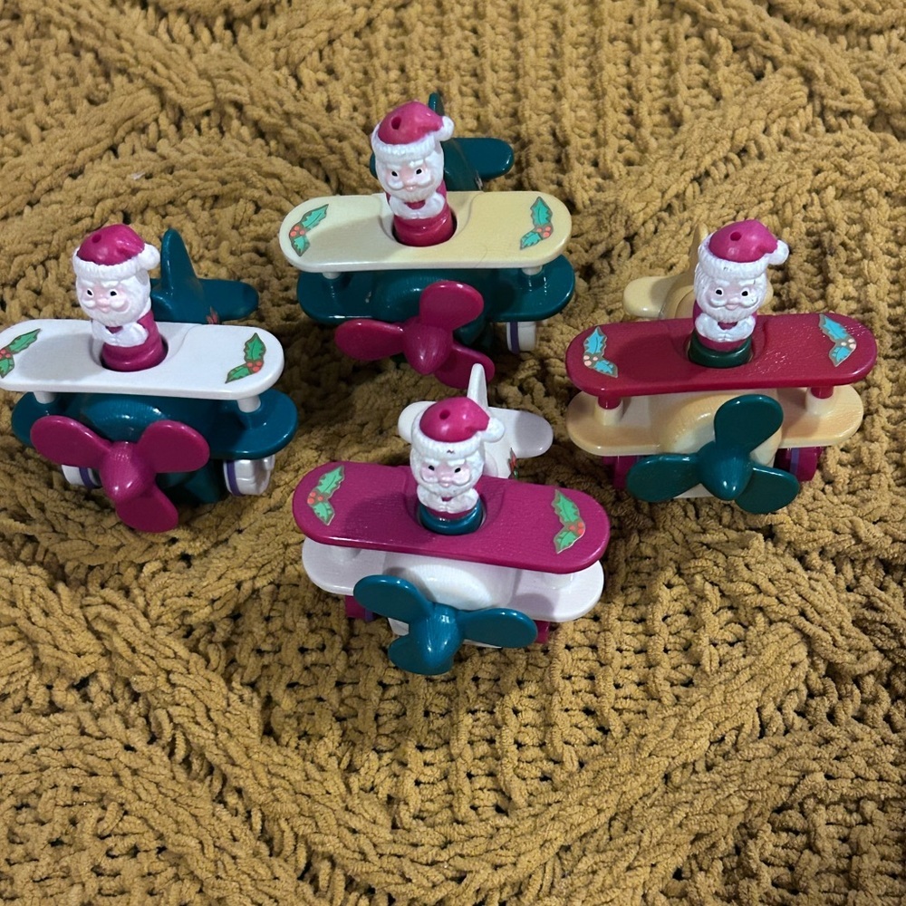$15 sale 4pc Russ 1998 Wind Up Santa in an plane